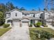 Two-story townhome with attached garage at 679 Mount Olympus Blvd, New Smyrna Beach, FL 32168