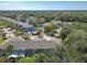 Aerial view of community with lake and homes at 679 Mount Olympus Blvd, New Smyrna Beach, FL 32168