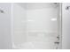 Clean bathroom with a shower and bathtub at 679 Mount Olympus Blvd, New Smyrna Beach, FL 32168