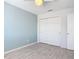 Bedroom with double door closet and an accent wall at 679 Mount Olympus Blvd, New Smyrna Beach, FL 32168
