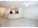 Living room features gray walls, wood-look floors, and an open floor plan at 679 Mount Olympus Blvd, New Smyrna Beach, FL 32168