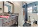 Clean bathroom with a tub shower combo and dark vanity at 510 Sun Lake Dr, Port Orange, FL 32127