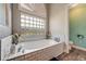 Spa-like bathroom with a soaking tub, and a separate shower at 510 Sun Lake Dr, Port Orange, FL 32127