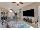 Spacious living room with gray sectional sofa and large TV at 510 Sun Lake Dr, Port Orange, FL 32127