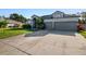 Two-story house with a three-car garage and well-maintained lawn at 510 Sun Lake Dr, Port Orange, FL 32127
