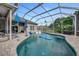 Inviting screened pool with a large deck and lush landscaping at 510 Sun Lake Dr, Port Orange, FL 32127
