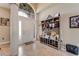 Bright entryway with tile flooring, coat rack, and bench at 510 Sun Lake Dr, Port Orange, FL 32127