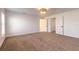 Spacious bedroom with carpet and access to bathroom at 2266 Hawks Cove Cir, New Smyrna Beach, FL 32168