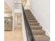 Elegant staircase with wrought iron railing leading to the second floor at 2266 Hawks Cove Cir, New Smyrna Beach, FL 32168