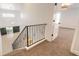 Upstairs hallway with carpet and view of a bedroom and stairs at 2266 Hawks Cove Cir, New Smyrna Beach, FL 32168