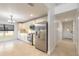 Bright kitchen features stainless steel appliances and an adjacent hallway at 2266 Hawks Cove Cir, New Smyrna Beach, FL 32168
