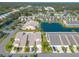 Community view showcasing homes, pool, and tennis court at 2266 Hawks Cove Cir, New Smyrna Beach, FL 32168
