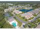 Community overview, pool, tennis court, and pond at 2266 Hawks Cove Cir, New Smyrna Beach, FL 32168