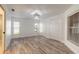 Spacious bedroom with wood-look tile flooring and double closets at 2266 Hawks Cove Cir, New Smyrna Beach, FL 32168