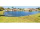 Community pond with gazebo and lush landscaping at 2266 Hawks Cove Cir, New Smyrna Beach, FL 32168