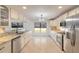 Eat-in kitchen with granite counters, stainless steel appliances, and ample cabinetry at 2266 Hawks Cove Cir, New Smyrna Beach, FL 32168