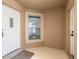 Light and bright entryway with white door and window at 2266 Hawks Cove Cir, New Smyrna Beach, FL 32168