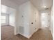 Bright hallway with carpet flooring and access to bedrooms at 2266 Hawks Cove Cir, New Smyrna Beach, FL 32168