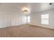Bright and airy bedroom with neutral decor and carpet at 2266 Hawks Cove Cir, New Smyrna Beach, FL 32168