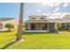 House with screened patio and grassy backyard at 2266 Hawks Cove Cir, New Smyrna Beach, FL 32168