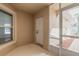 Bright lanai with screened enclosure, window, and exterior access at 2266 Hawks Cove Cir, New Smyrna Beach, FL 32168