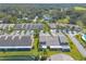 Aerial view of community with pond and homes at 2266 Hawks Cove Cir, New Smyrna Beach, FL 32168
