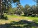 Wooded residential lot with a clearing and old structures at 689 Eagle Watch Rd, Oak Hill, FL 32759