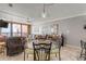 Dining area with glass-top table and four chairs, ocean view at 4141 S Atlantic Ave # 502, New Smyrna Beach, FL 32169