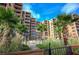 Oceanfront building with lush landscaping and walkway at 4141 S Atlantic Ave # 502, New Smyrna Beach, FL 32169