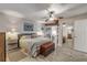 Main bedroom with a striped comforter and dresser at 4141 S Atlantic Ave # 502, New Smyrna Beach, FL 32169
