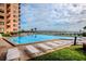 Relaxing community pool with plenty of lounge chairs at 4141 S Atlantic Ave # 502, New Smyrna Beach, FL 32169