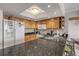 Kitchen with granite countertops and wood cabinets at 4141 S Atlantic Ave # 502, New Smyrna Beach, FL 32169