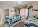 Guest bedroom with twin beds and coastal decor at 4141 S Atlantic Ave # 502, New Smyrna Beach, FL 32169