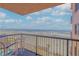 Balcony with ocean view, chairs, and small table at 4141 S Atlantic Ave # 502, New Smyrna Beach, FL 32169