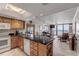 Open kitchen with granite countertops, wood cabinets, and ocean view at 4141 S Atlantic Ave # 502, New Smyrna Beach, FL 32169