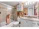 Bathroom with tub shower combination and updated vanity at 4141 S Atlantic Ave # 502, New Smyrna Beach, FL 32169