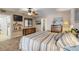 Bedroom with striped bedding, dresser and tiled floors at 4141 S Atlantic Ave # 502, New Smyrna Beach, FL 32169