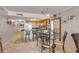 Kitchen with island, granite counters, and breakfast bar seating at 4141 S Atlantic Ave # 502, New Smyrna Beach, FL 32169