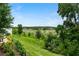 Landscaped backyard with scenic pond views at 2352 Litchfield Loop, Deland, FL 32720