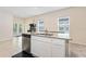 Granite kitchen island with sink and dishwasher, offering extra counter space at 2352 Litchfield Loop, Deland, FL 32720