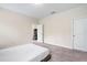 Spacious bedroom with carpeted floor and access to game room at 2352 Litchfield Loop, Deland, FL 32720