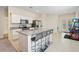 Kitchen island with granite countertop and seating for three at 2352 Litchfield Loop, Deland, FL 32720
