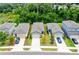 Aerial view of houses with gray roofs and various colors at 2352 Litchfield Loop, Deland, FL 32720