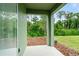 Covered patio with woodchip landscaping at 2352 Litchfield Loop, Deland, FL 32720