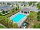 Community pool with lounge chairs and covered seating at 2352 Litchfield Loop, Deland, FL 32720
