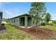 Home's exterior with backyard view and landscaping at 2352 Litchfield Loop, Deland, FL 32720