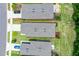 Three homes with gray roofs and driveways, viewed from above at 2352 Litchfield Loop, Deland, FL 32720