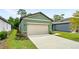 Exterior view of the home's two-car garage at 2352 Litchfield Loop, Deland, FL 32720