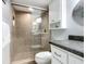 Clean bathroom with a walk-in shower and white vanity at 5303 S Atlantic Ave # 270, New Smyrna Beach, FL 32169