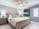 King-size bed, coastal decor, and built-in shelving at 5303 S Atlantic Ave # 270, New Smyrna Beach, FL 32169
